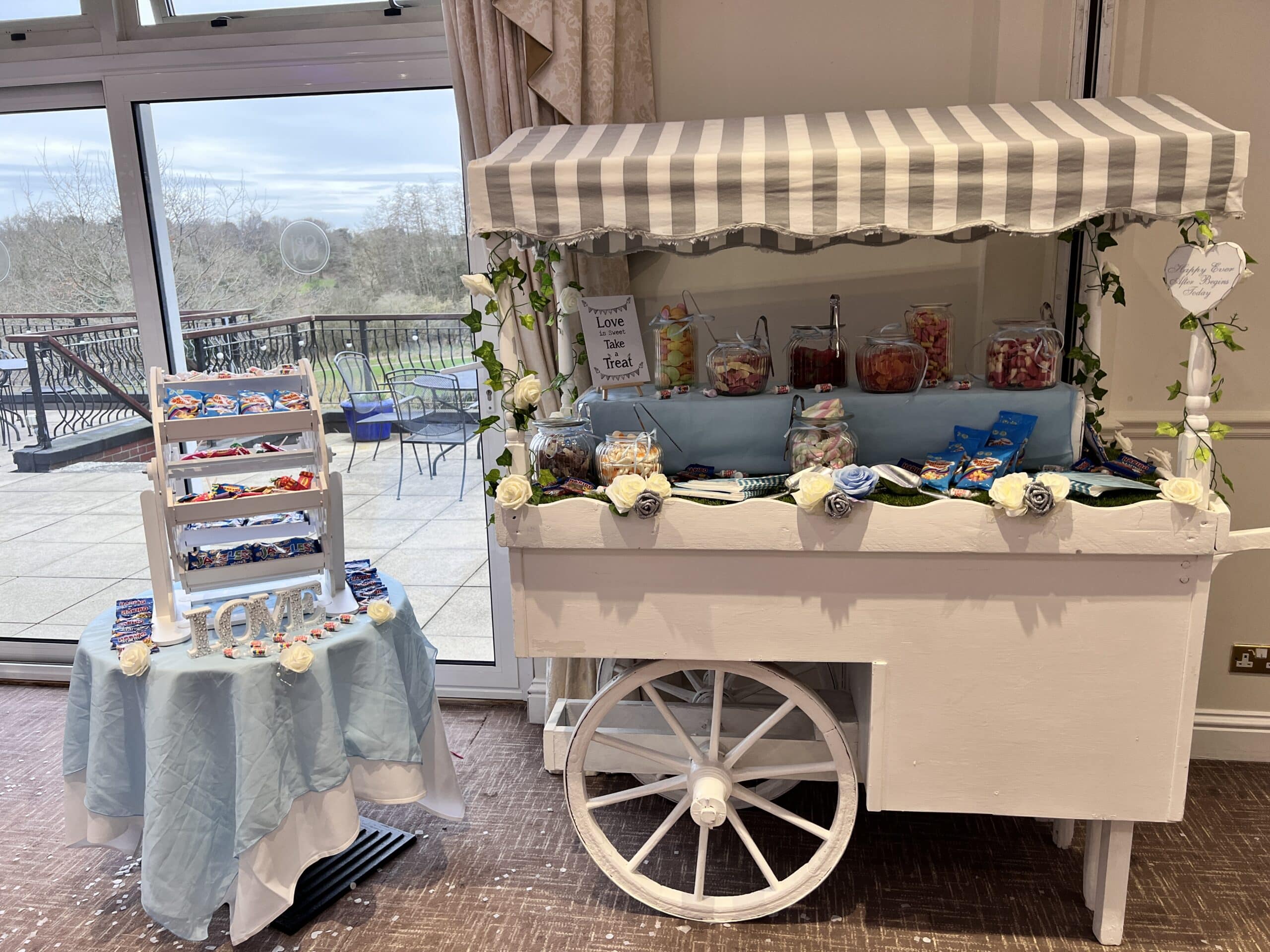 sweet-cart next to table of sweets