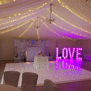 love sign in the corner of wedding reception