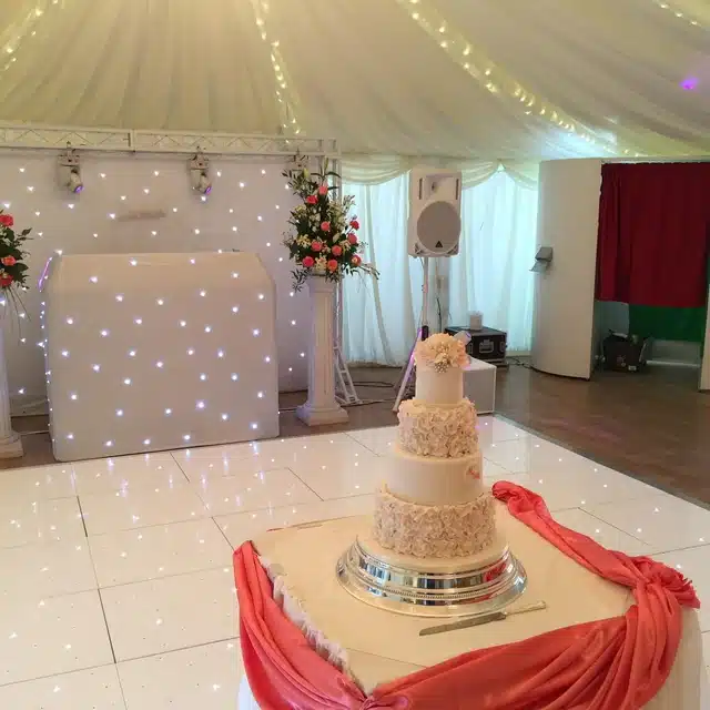 Dance floor with wedding cake